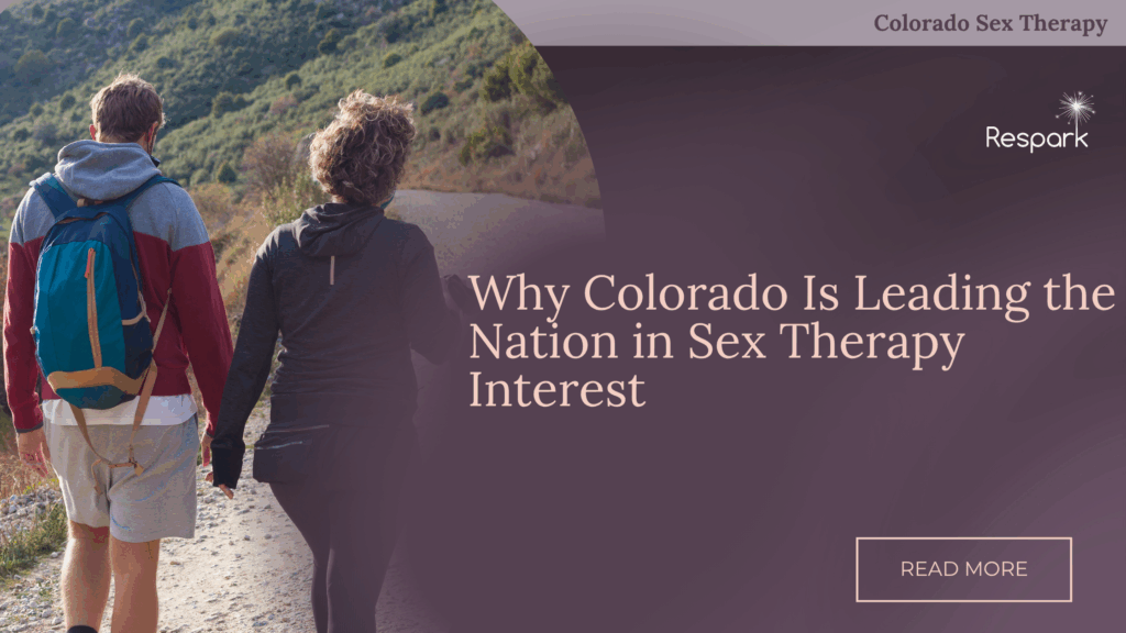 A couple holding hands on a Colorado mountain trail, symbolizing intimacy and emotional connection through sex therapy.